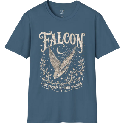 A grunge tee with an illustrated falcon wing design, crescent moon, and botanical linework, text reading "Falcon" and "She Strikes Without Warning" — Wild Animals collection by Ramro Yoga Wear in Indigo Blue