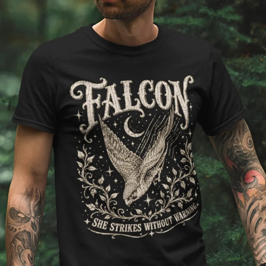Person wearing the Falcon T-Shirt in Black, standing outdoors in a wooded setting — Wild Animals collection by Ramro Yoga Wear.