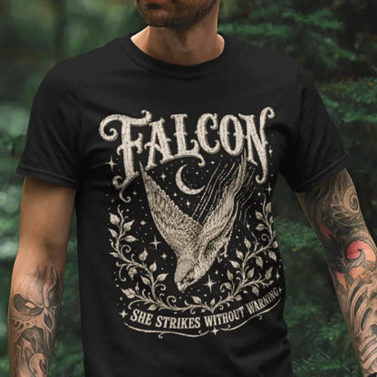 Person wearing the Falcon T-Shirt in Black, standing outdoors in a wooded setting — Wild Animals collection by Ramro Yoga Wear.