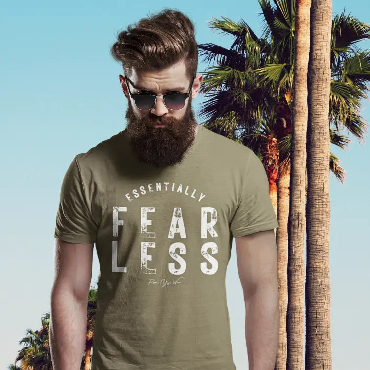 Person wearing the Fear Less T-Shirt in Heather Olive, standing outdoors near palm trees — Funny Yoga Shirts collection by Ramro Yoga Wear.