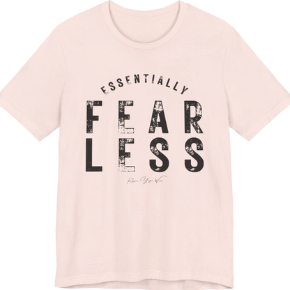 A typographic grunge tee reading "Essentially Fear Less" in bold block lettering — Funny Yoga Shirts collection by Ramro Yoga Wear in Soft Pink.