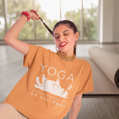 Woman wearing Floor Heather Orange yoga T-Shirt having fun in the yoga studio — The Vault collection by Ramro Yoga Wear