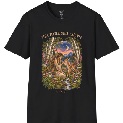 A short sleeved tee called the Gentle T-Shirt, flat lay and a Gildan 64000 shirt. Simply says, Still Gentle, Still Untamed. Design highlights a woman with wildflowers in her hair kneeling in a birch forest, gently cupping the chin of a spotted fawn, with foxgloves, ferns and a small stream below a crescent moon at twilight, in a full-color painted illustration style. Color is Black.
