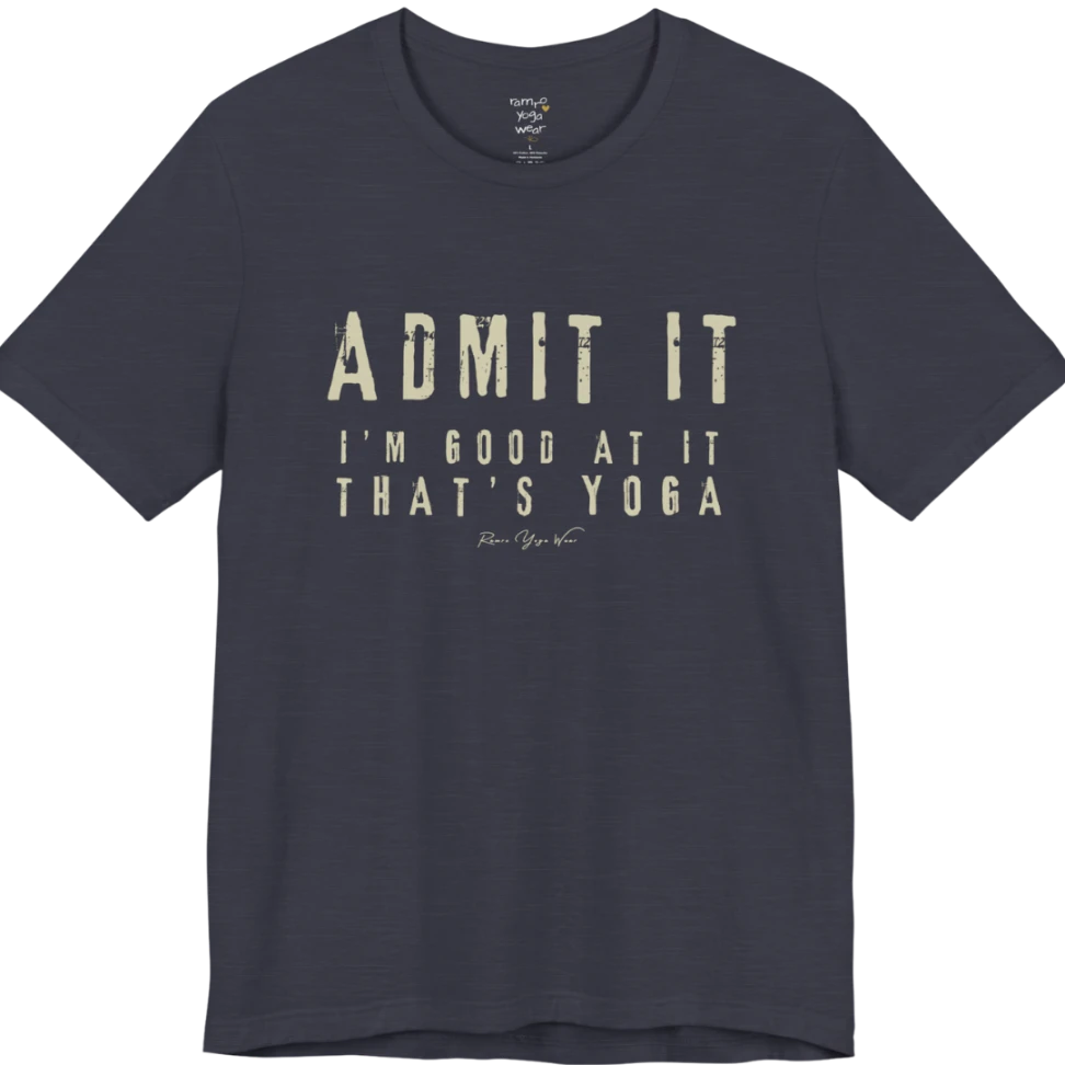 A short sleeved tee called the Good T-Shirt, flat lay and a Bella+Canvas 3001 shirt. Simply says, Admit It, I'm Good At It, That's Yoga. Design highlights bold distressed cream lettering with ADMIT IT large above two smaller lines of wide-spaced text. Color is Heather Midnight Navy.