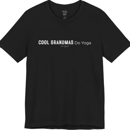 A short sleeved tee called the Grandmas T-Shirt, flat lay and a soft cotton blend shirt. Simply says, Cool Grandmas Do Yoga. Design highlights bold distressed block lettering for COOL GRANDMAS beside thin lettering for Do Yoga, with a small script signature underneath. Color is Black.