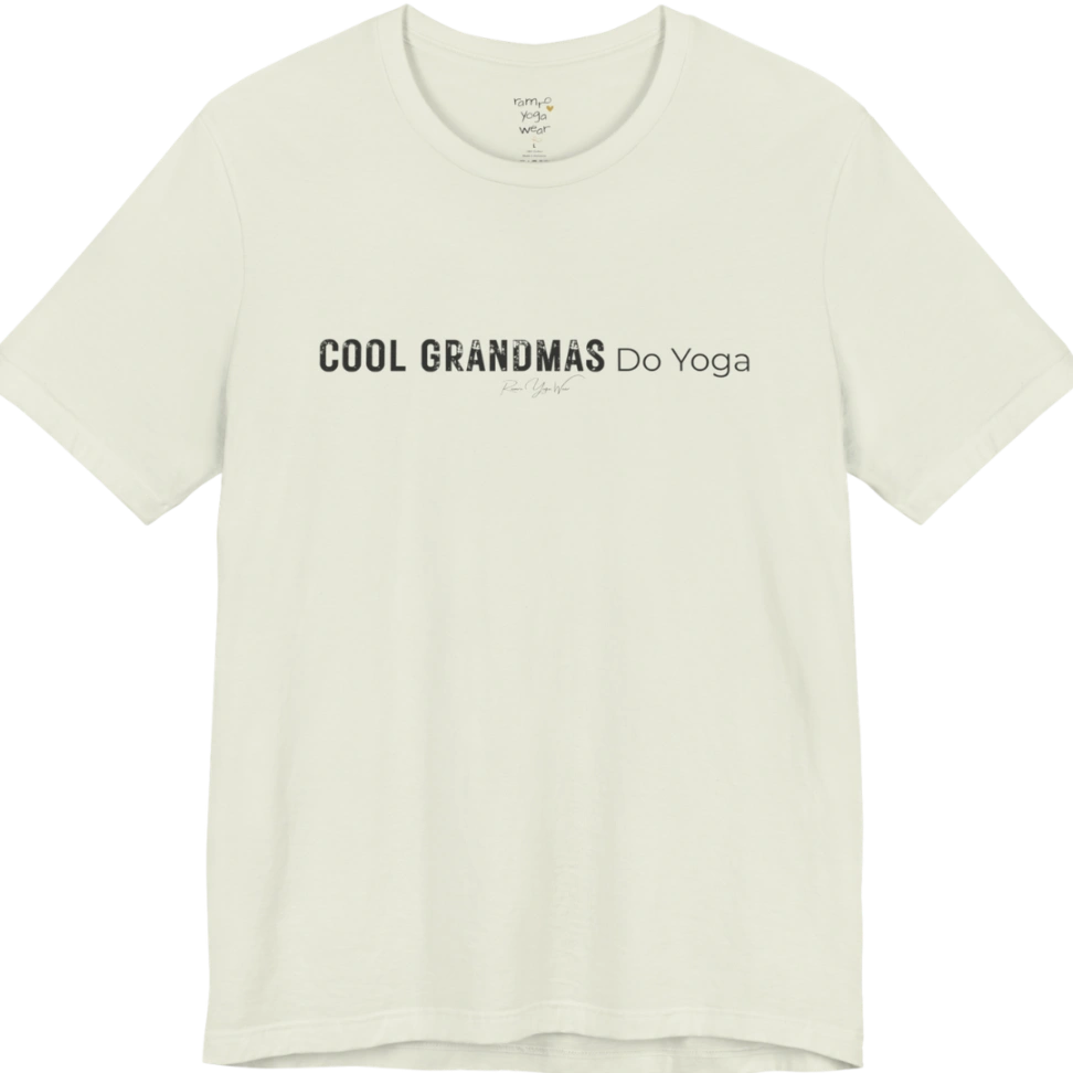 A short sleeved tee called the Grandmas T-Shirt, flat lay and a soft cotton blend shirt. Simply says, Cool Grandmas Do Yoga. Design highlights bold distressed block lettering for COOL GRANDMAS beside thin lettering for Do Yoga, with a small script signature underneath. Color is Citron.