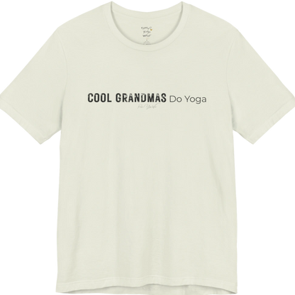 A short sleeved tee called the Grandmas T-Shirt, flat lay and a soft cotton blend shirt. Simply says, Cool Grandmas Do Yoga. Design highlights bold distressed block lettering for COOL GRANDMAS beside thin lettering for Do Yoga, with a small script signature underneath. Color is Citron.