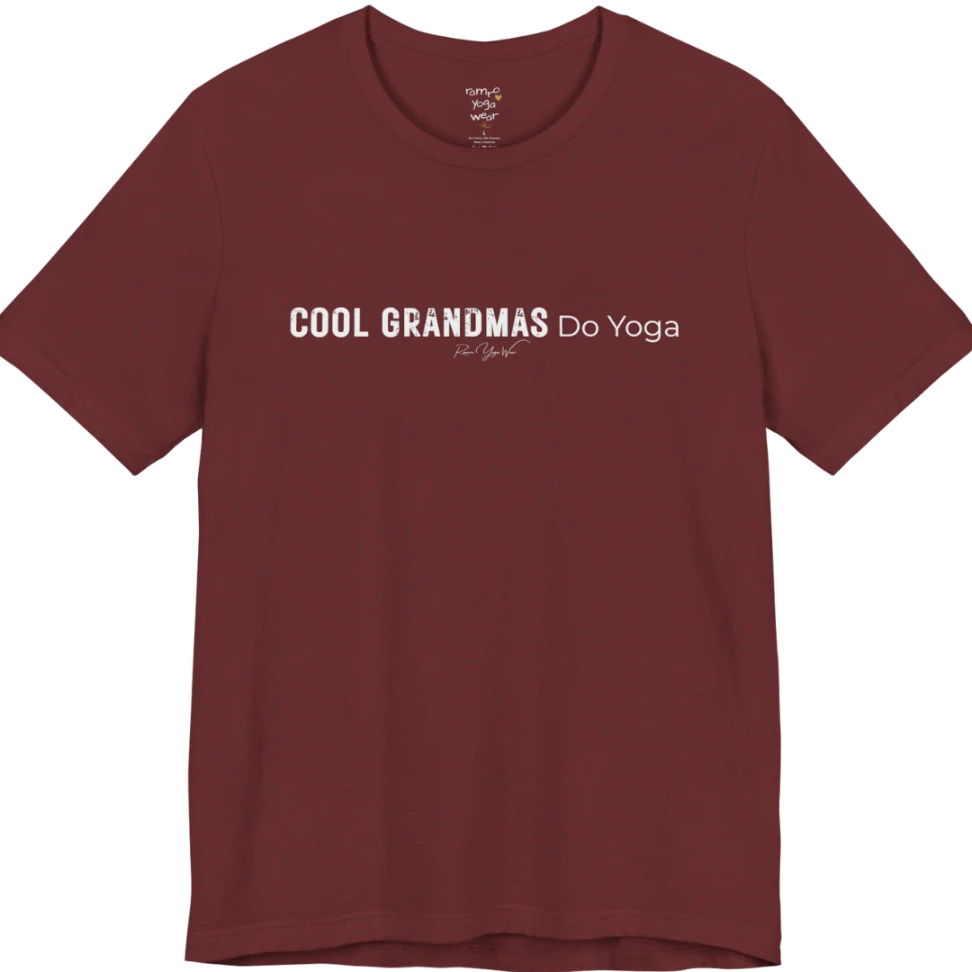 A short sleeved tee called the Grandmas T-Shirt, flat lay and a soft cotton blend shirt. Simply says, Cool Grandmas Do Yoga. Design highlights bold distressed block lettering for COOL GRANDMAS beside thin lettering for Do Yoga, with a small script signature underneath. Color is Heather Cardinal.