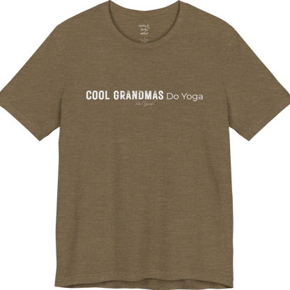 A short sleeved tee called the Grandmas T-Shirt, flat lay and a soft cotton blend shirt. Simply says, Cool Grandmas Do Yoga. Design highlights bold distressed block lettering for COOL GRANDMAS beside thin lettering for Do Yoga, with a small script signature underneath. Color is Heather Olive.