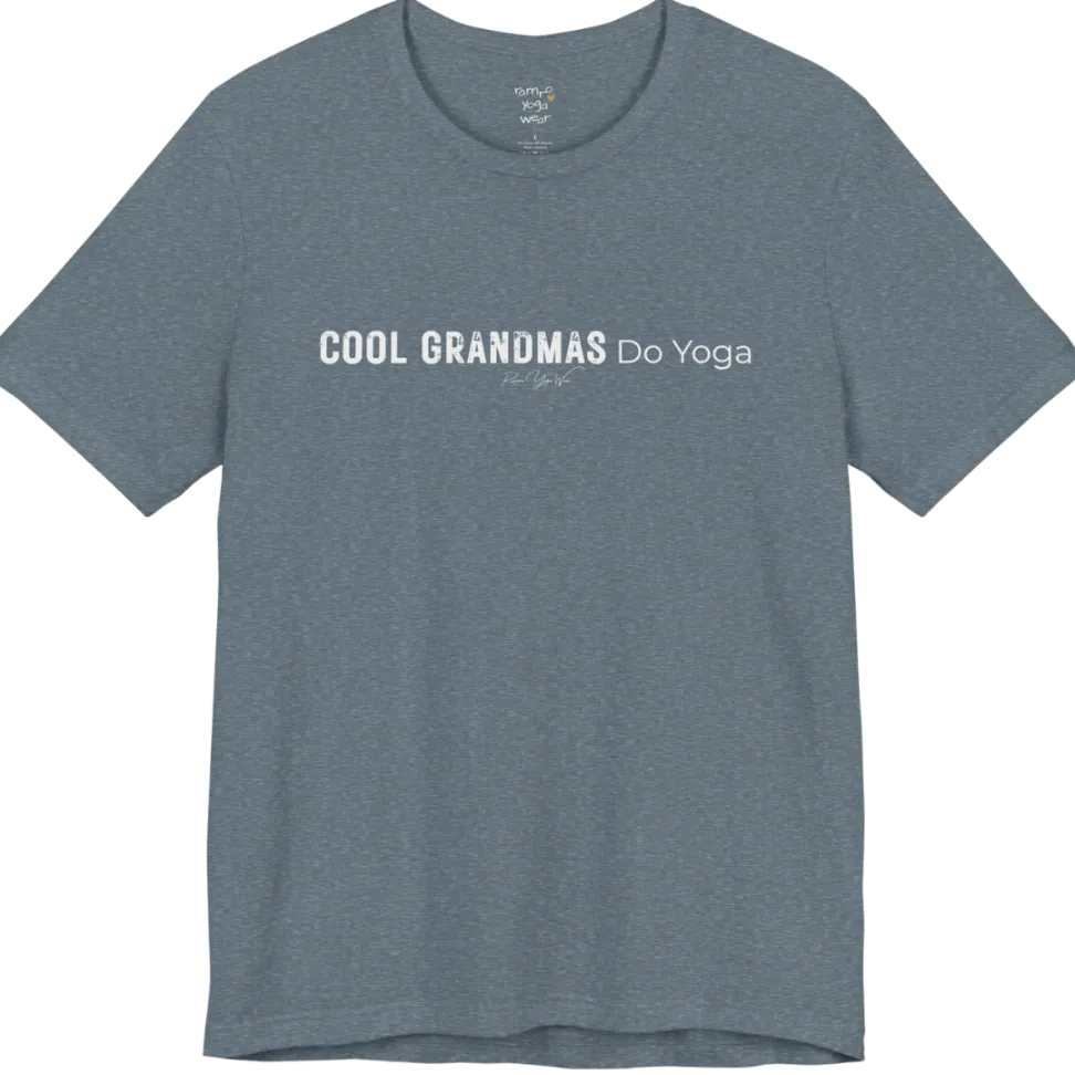 A short sleeved tee called the Grandmas T-Shirt, flat lay and a soft cotton blend shirt. Simply says, Cool Grandmas Do Yoga. Design highlights bold distressed block lettering for COOL GRANDMAS beside thin lettering for Do Yoga, with a small script signature underneath. Color is Heather Slate.