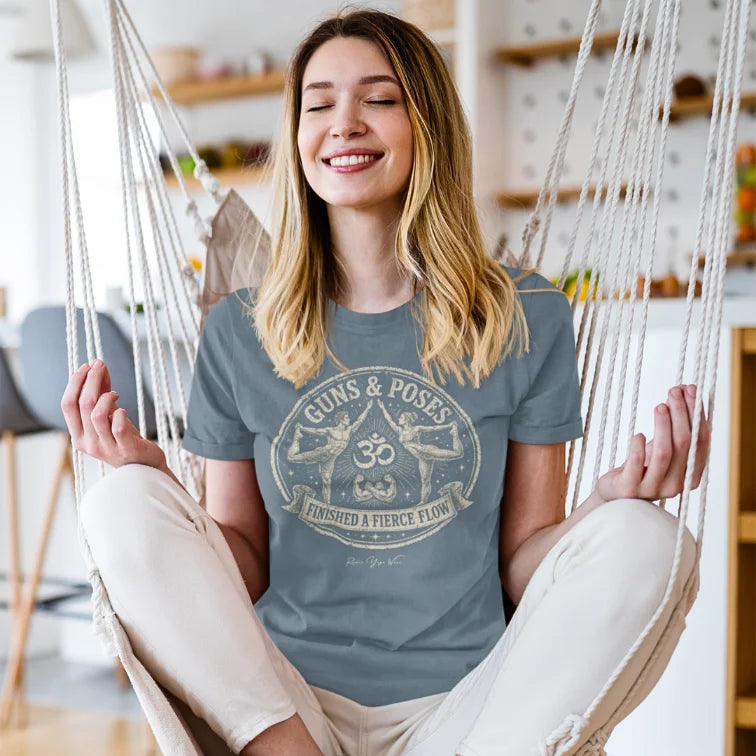 Person wearing Guns Poses tee in Heather Slate sacred yoga shirt relaxing in a hammock chair — Funny Yoga Shirts collection by Ramro Yoga Wear