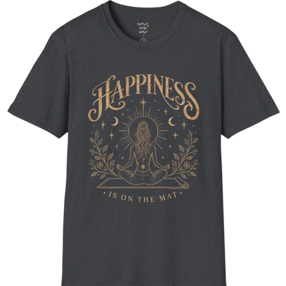 A short sleeved tee called the Happiness T-Shirt, flat lay and a soft cotton shirt. Simply says, Happiness is on the mat. Design highlights ornate warm gold HAPPINESS lettering above a figure meditating cross-legged on a yoga mat, seen from behind beneath a thin sun halo, with crescent moons, stars and botanical sprigs. Color is Dark Heather Grey.
