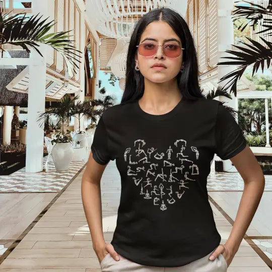 Woman wearing the Heart T-Shirt in Black walking outdoors with sunglasses — The Vault collection by Ramro Yoga Wear