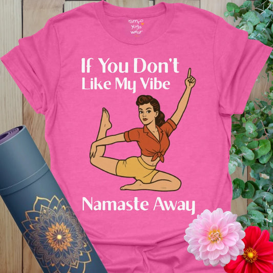 Vibrant pink heather t-shirt with cheeky dancer pose yogi and bold yoga humor text.