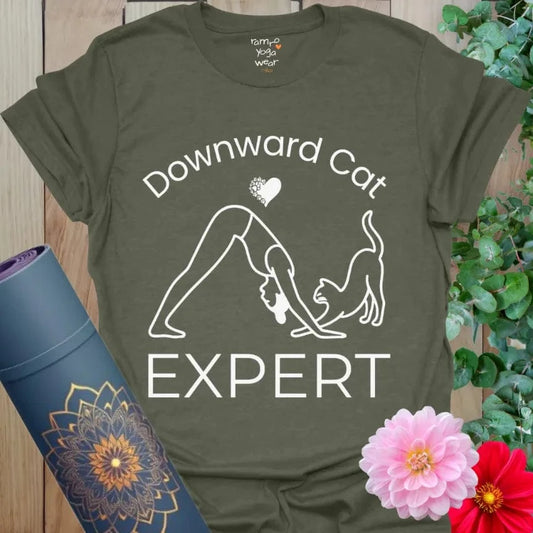 Heather Military Green Cat Expert T-Shirt featuring a yogi in Downward Dog pose with a playful cat, text reads "Downward Cat Expert."