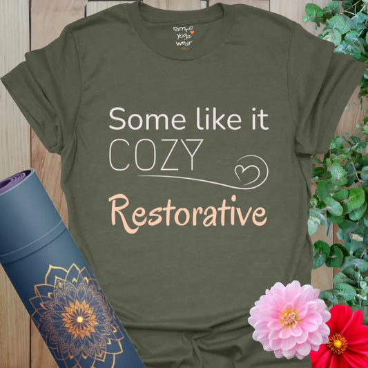 Heather Military Green tee featuring “Some Like It Cozy – Restorative.” Yoga shirt with earthy tone and gentle message.