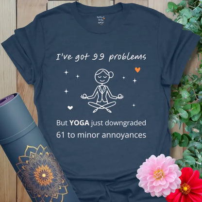 Heather Navy 99 Problems T-Shirt featuring humorous yoga saying “I’ve got 99 problems but YOGA just downgraded 61 to minor annoyances.” That has to make everyone laugh.
Strong Heather Navy tone with clean white design and orange heart accent.