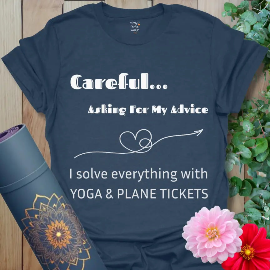Heather Navy Careful T-Shirt with the quote “Careful… Asking For My Advice. I solve everything with yoga & plane tickets,” featuring a heart-arrow line art. Yoga and travel humor tee.