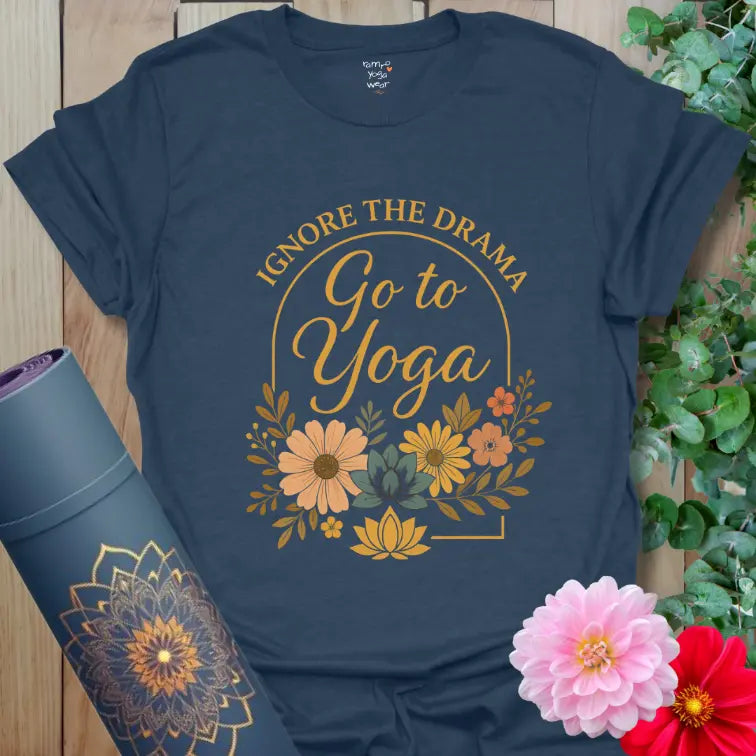 Elegant floral arch design with “Ignore the Drama – Go to Yoga” text printed on a deep heather navy yoga tee.