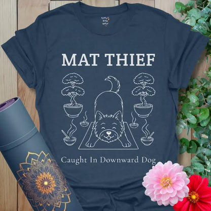 Heather Navy Mat Thief T-Shirt featuring a playful dog in Downward Dog pose with bonsai accents; fun yoga humor for dog lovers.