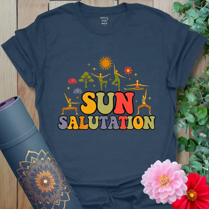 Heather Navy Sun Salutation T-Shirt with bold contrast print and glowing sunrise. Yoga tee representing strength, warmth, and centered energy.