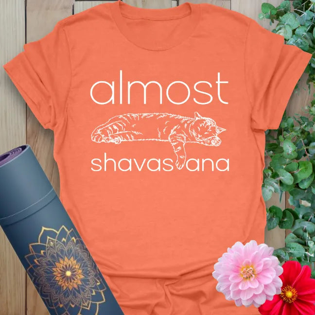Heather Orange Almost Shavasana T-Shirt – spiritual graphic tee with humorous yoga message by Ramro Yoga Wear. 