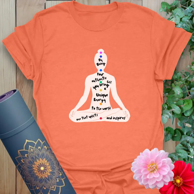 Vibrant orange yoga t-shirt with self-expression and energy-centered design