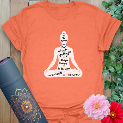 Vibrant orange yoga t-shirt with self-expression and energy-centered design