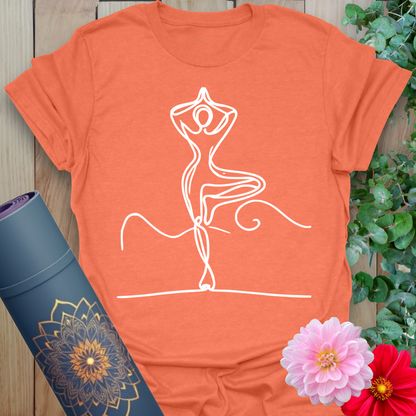 Heather orange unisex shirt with flowing line drawing of tree pose