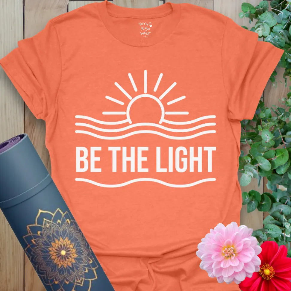 Heather orange Be The Light T-Shirt with bright yoga graphic and calm energy.