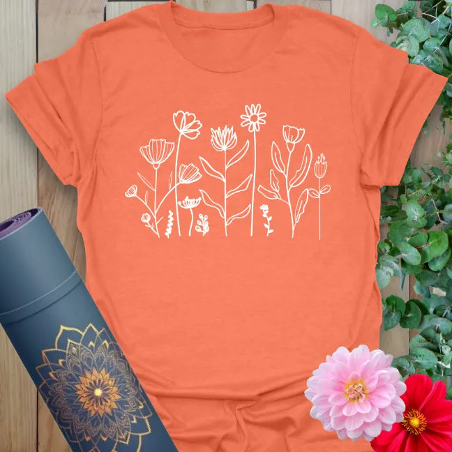 Heather orange t-shirt with playful nature-inspired flower illustration