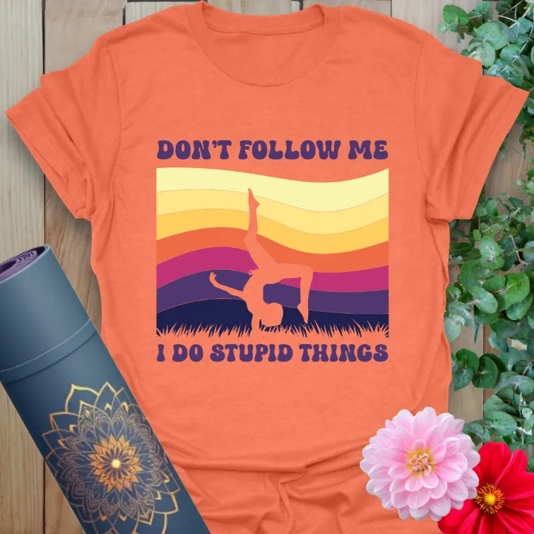 Heather orange Don't Follow T-Shirt with retro sunset and fun yoga handstand pose

