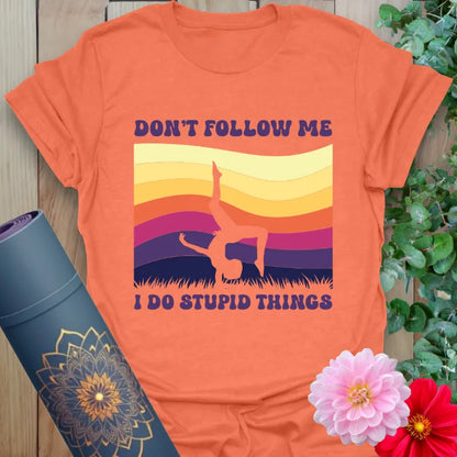 Heather orange Don't Follow T-Shirt with retro sunset and fun yoga handstand pose

