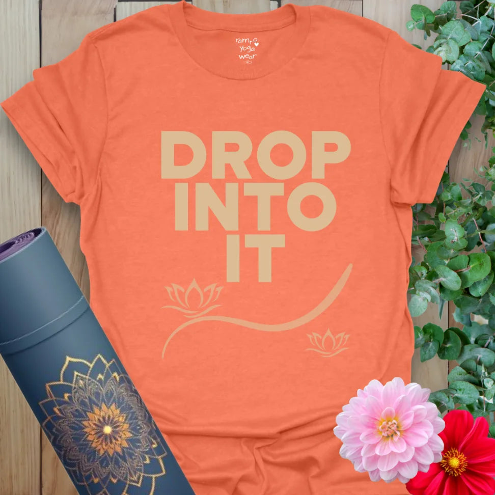 Heather Orange Drop Into It T-Shirt with warm typography and clean layout. A soft cotton yoga shirt for flow, movement, and daily wear.