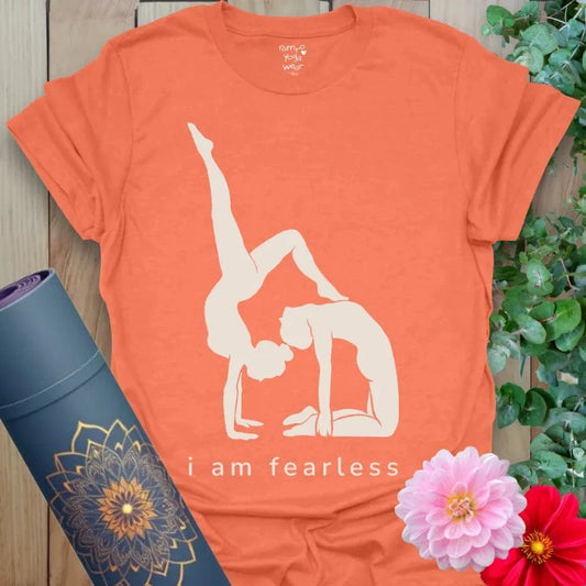 Heather Orange Fearless T-Shirt featuring “I Am Fearless” slogan and yogi silhouette. Vibrant yoga gift tee for empowerment and mindful movement.