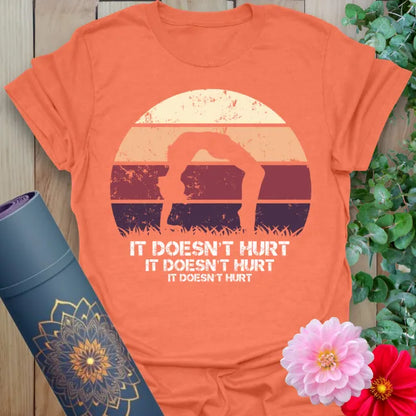 Vibrant orange yoga t-shirt showcasing playful yoga humor design inspiring conscious movement and heart-led laughter.