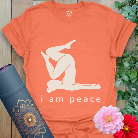 Heather Orange tee with calming yoga pose silhouette and the words "i am peace."