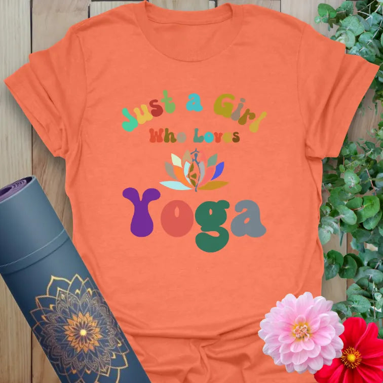 Vibrant orange yoga t-shirt showcasing playful multicolor yoga graphic perfect for light-hearted, soulful living.