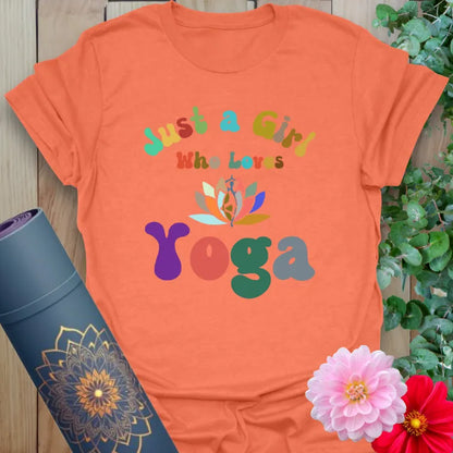 Vibrant orange yoga t-shirt showcasing playful multicolor yoga graphic perfect for light-hearted, soulful living.