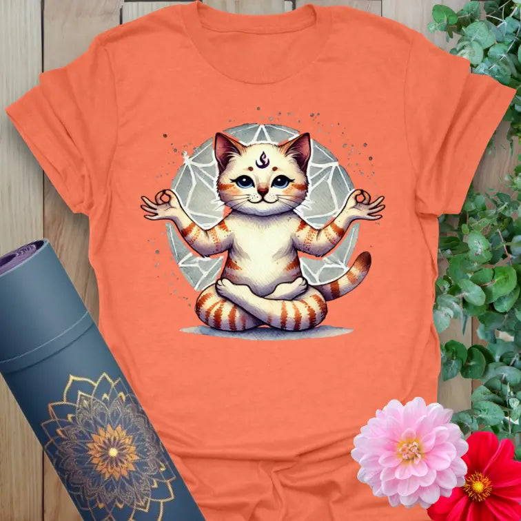 Vibrant orange yoga t-shirt showcasing adorable yoga cat design with sacred geometric background for playful, conscious movement.