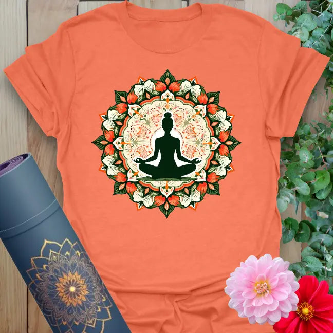Vibrant orange yoga t-shirt showcasing serene meditation silhouette and colorful mandala inspiring soulful balance and spiritual expansion.