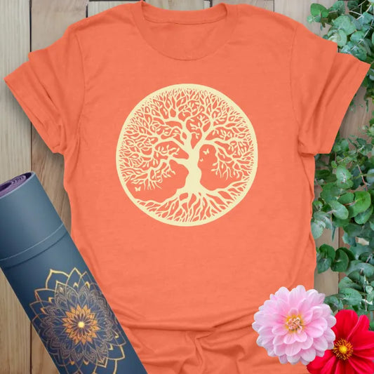 Vibrant orange yoga t-shirt showcasing intricate Tree of Life artwork inspiring personal growth, strength, and mindful living.