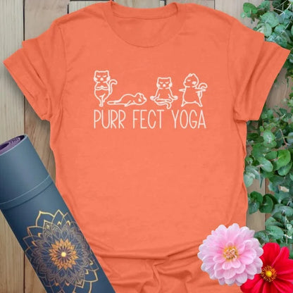 Vibrant orange yoga t-shirt showcasing cute cat yoga pose artwork inspiring soulful movement and joyful mindfulness.