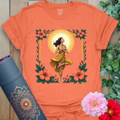 Vibrant orange yoga t-shirt showcasing yogi and golden sun design inspiring joyful, conscious movement and soulful strength.