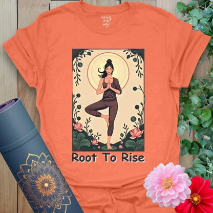 Vibrant orange t-shirt with colorful yoga art and motivational “Root to Rise” quote for conscious, empowered style.