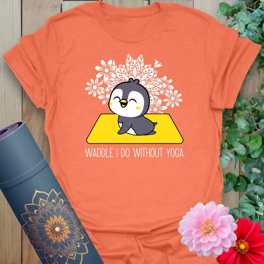 Vibrant orange t-shirt with adorable penguin in lotus pose and snowflake mandala design for playful yoga wear.