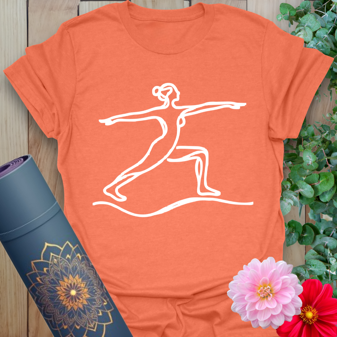 Vibrant orange t-shirt with flowing line art of strong yoga pose symbolizing resilience and intention.