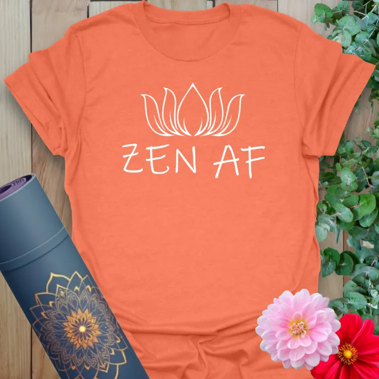 Vibrant orange t-shirt with modern lotus illustration and edgy yoga quote for bold mindful energy.