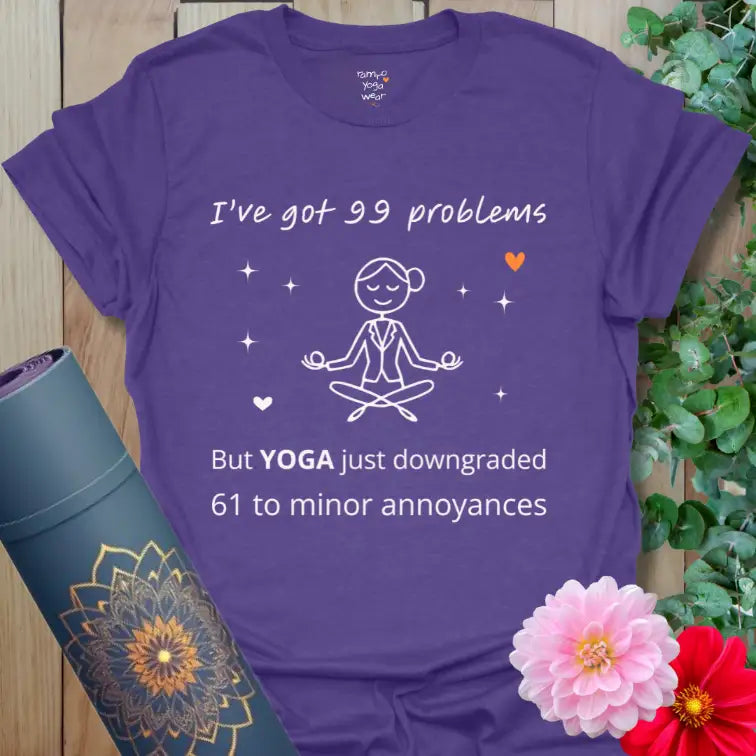 Heather Purple 99 Problems T-Shirt featuring humorous yoga saying “I’ve got 99 problems but YOGA just downgraded 61 to minor annoyances.”
Calm purple tone with clean white design and orange heart accent.

