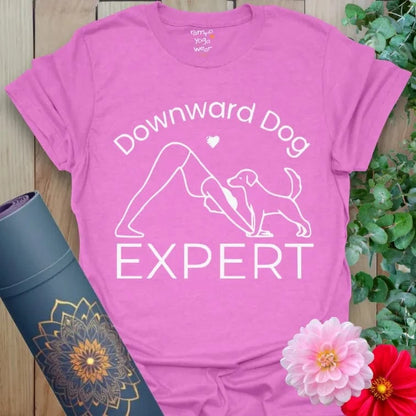 Heather Radiant Orchid Dog Expert T-Shirt showcasing playful dog and yogi in Downward Dog.